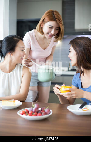 Best female friends cooking at home Stock Photo