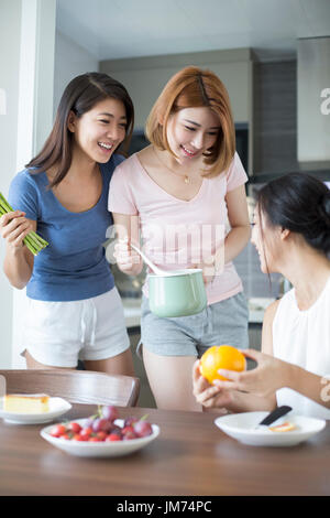 Best female friends cooking at home Stock Photo