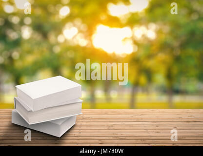 stack of blank notebooks on wooden table Stock Photo