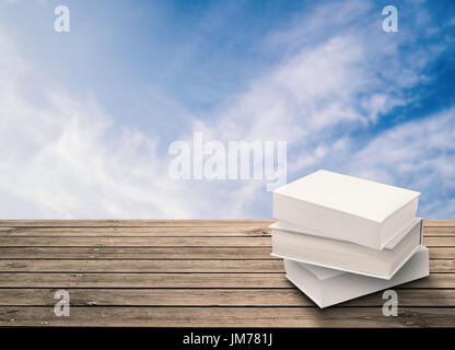 stack of blank notebooks on wooden table Stock Photo