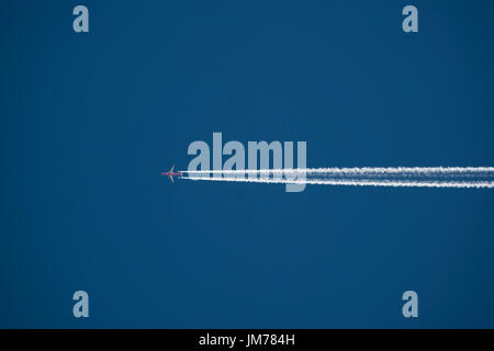 Flying high in the sky, Aeroplane - Airplane against clear blue sky with vapour trail. credit: LEE RAMSDEN / ALAMY Stock Photo