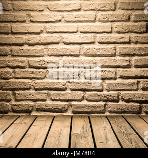 white brick wall  background on wooden floor Stock Photo