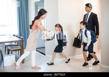 Happy Chinese children come back home from school Stock Photo