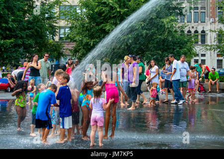 Kids playing at water park in downtown Chicago's Millennium Park. Stock Photo