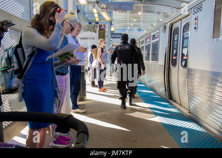 business as usual. k-9 unit police patrol subway station in Chicago, il. Stock Photo