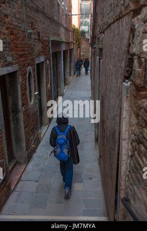 People on a narrow Venice street Stock Photo