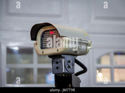 CCTV security camera on the wall Stock Photo