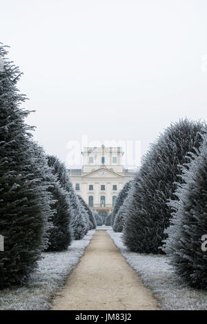 Esterhazy castle backyard in winter with dirt road and yew trees, Fertod Stock Photo