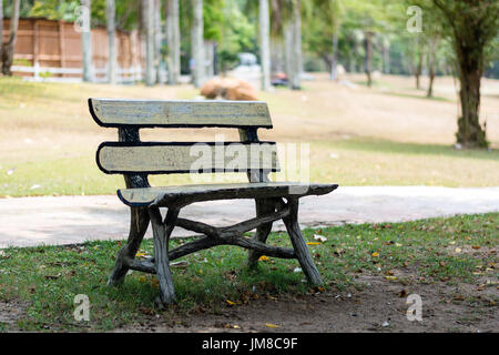 Empty wooden bench in the city park with copy space Stock Photo