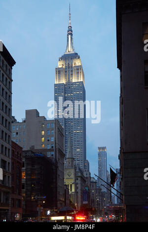 Empire State Building from Fifth Avenue illuminated in the evening on September 11, 2016 in New York Stock Photo