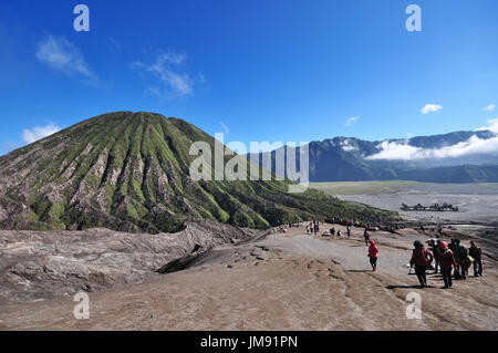 SURABAYA, INDONESIA - MAY 11, 2015: Tourists at the foothill of Mount Bromo Tengger Semeru National park in East Java, Indonesia. Stock Photo