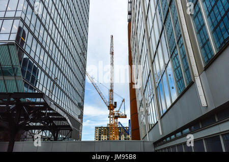 The tall business skyscrapers and the construction crane in the heart of Montreal downtown. Stock Photo