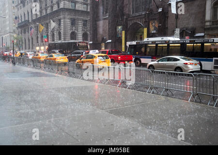 empty sidewalk in heavy rain fifth avenue New York City USA Stock Photo