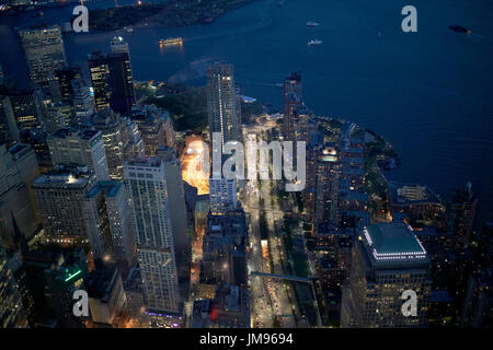 aerial view through glass of battery park city and financial district lower manhattan from one world observatory New York City USA Stock Photo