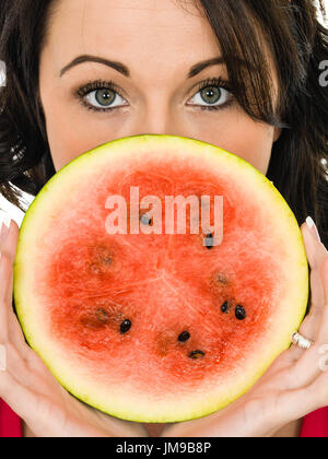 Young Woman Holding a Fresh Ripe Juicy Watermelon Isolated Against A White Background Stock Photo