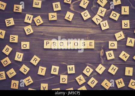 Propose word wood block on table for business concept. Stock Photo