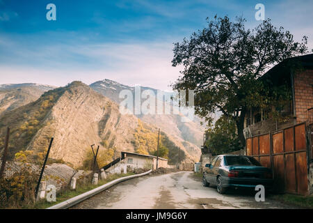 Khidistavi - Ateni - Boshuri Road, Patara Ateni, Shida Kartli Region, Georgia. Car Parked Near Country Road In Didi Ateni Village In Sunny Autumn Day. Stock Photo