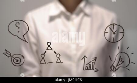 Businesswoman in front of virtual screen with copy space for text or design. Stock Photo