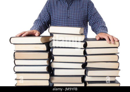 Man with hands on a pile of many old books isolated on white background Stock Photo