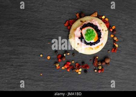 Homemade pancake canapes on slate stone plate for finger food party Stock Photo