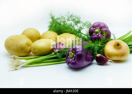 Assortment of fresh raw vegetables isolated on white background. Selection includes potato, green onion, pepper, garlic and dill Stock Photo