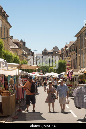 Couple walking through the open air street market in Sarlat, France, Europe Stock Photo