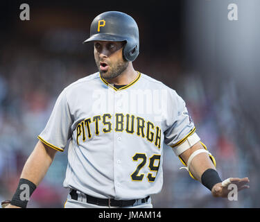 Pittsburgh Pirates Francisco Cervelli (29) and home plate umpire DJ  Reyburn, left, react after both being hit by a pitch as Toronto Blue Jays  catcher Dioner Navarro, centre, looks to help during