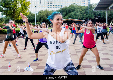 Houston, USA. 26th July, 2017. People take part in a Zumba class in Discovery Green, a public urban park in Downtown Houston, Texas, the United States, July 26, 2017. Credit: Scott Julian/Xinhua/Alamy Live News Stock Photo