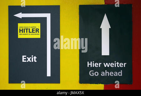 Berlin, Germany. 27th July, 2017. Direction signs at the 'Hitler: How Could it Happen?' exhibition in the bunker at Anhalter Bahnhof in Berlin, Germany, 27 July 2017. The exhibition covers the period between Hitler's birth and his death in 1945. Photo: Wolfgang Kumm/dpa/Alamy Live News Stock Photo