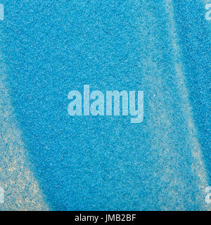 Macro shot of a blue sand texture. Particles of blue sand from a short distance. Stock Photo
