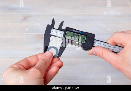 Measurement of the diameter of the gasket with electronic caliper Stock Photo