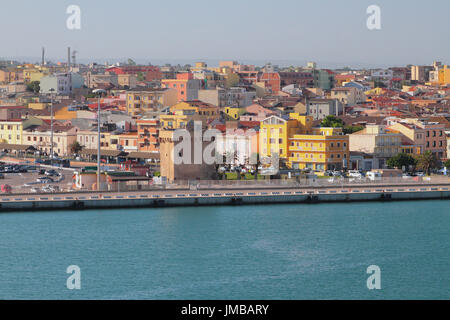 Embankment, ancient tower and city. Porto-Torres, Italy Stock Photo