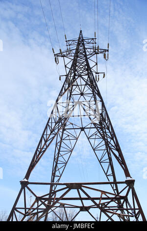 High voltage tower against blue sky Stock Photo