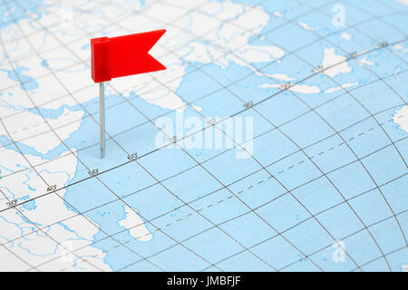 Journey concept. Red plastic flag pin standing on map Stock Photo