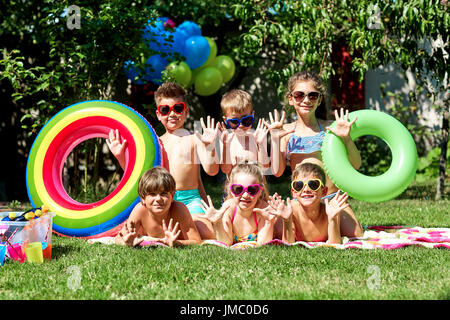 A group of children in swimsuits in the summer  Stock Photo