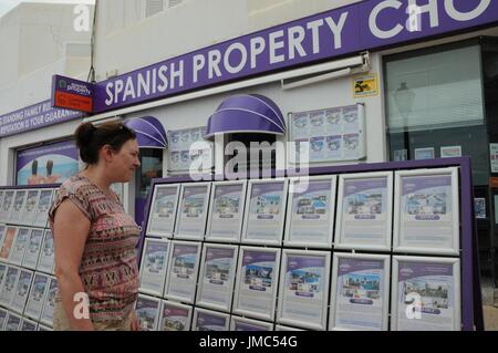 A woman looks at properties in Mojacar, Spain. Stock Photo