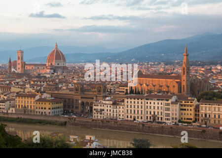 The view of Florence at sunset light. Cattedrale di Santa Maria del Fiore and Basilica di Santa Croce. Tuscany. Italy.