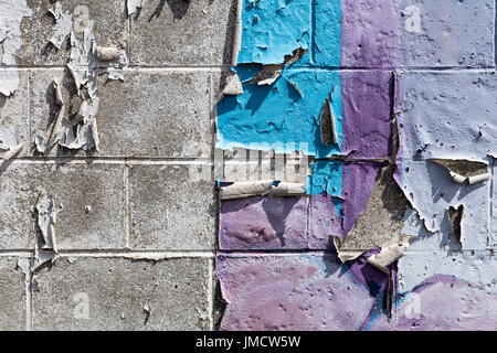 Peeling paint on a brick wall