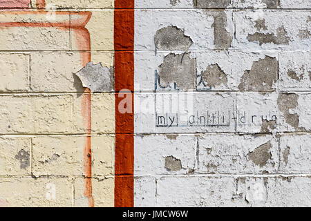 Peeling paint on a brick wall Stock Photo