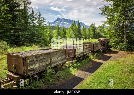 Historic coal mine train in the ghost town of Bankhead with Mt. Rundle in the background located in Banff National Park, Alberta, Canada. Stock Photo