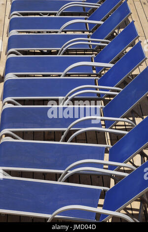 Deckchairs lined up by the pool on a cruise ship Stock Photo