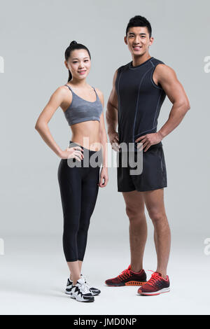 Young Chinese couple wearing gym suit Stock Photo