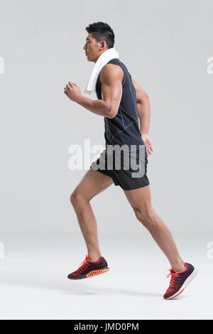 Male Chinese athlete running Stock Photo