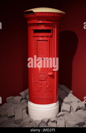 Embargoed to 0001 Friday July 28 A George V Pillar Box, 1927-1935, which was damaged during the Second World War, on display during a preview of the Postal Museum in London. Stock Photo