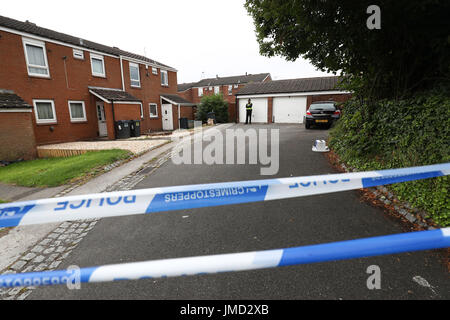 EDITORS NOTE IMAGE PIXELATED BY PA PICTURE DESK Police at the scene where armed officers have shot a man and another has been arrested after an incident in Hereford Close, Frankley, Birmingham. Stock Photo