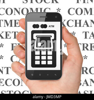 Banking concept: Hand Holding Smartphone with ATM Machine on display Stock Photo