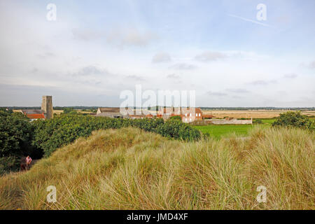 A view from the sand dunes looking over farmland and the small coastal community of Waxham, Norfolk, England, United Kingdom. Stock Photo