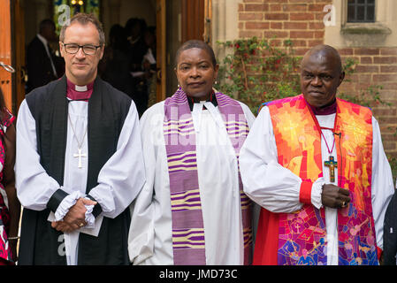 (left to right) Bishop of Kensington Rt Revd Graham Tomlin, Speaker's Chaplain Rev Preb Rose Hudson-Wilkin and the Archbishop of York Dr John Sentamu attend a memorial service for Mary Mendy, 54, Khadija Saye, 24, Berkti Haftom, 29, Beruk Haftom,12 and Isaac (Welde Mariam), 5, victims of the fire at Grenfell Tower, at St Helen&Otilde;s Church in London. Stock Photo