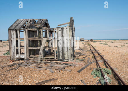 Wooden house and boat falling into ruins Stock Photo