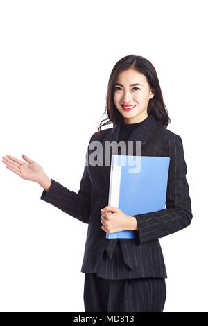 young asian businesswoman holding a file folder, studio shot, isolated on white background. Stock Photo